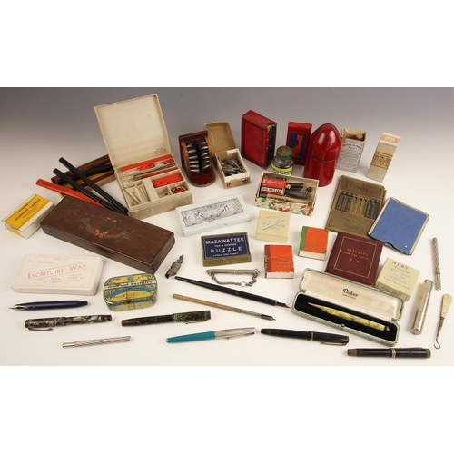 85 - A collection of fountain pens and further writing equipment, including a Parker propelling pencil, w... 