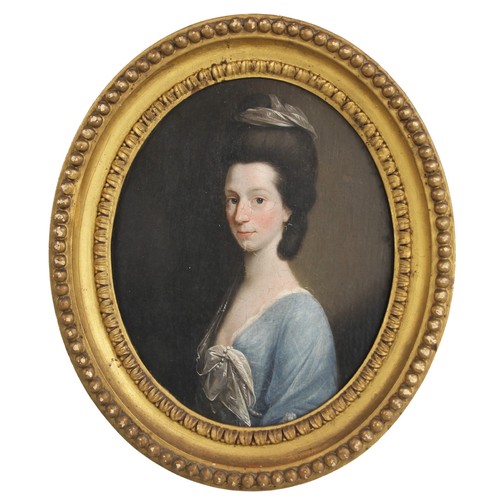 142 - Circle of John Downman (Welsh, 1750-1824),  
An oval bust length portrait of a lady wearing a blue d... 