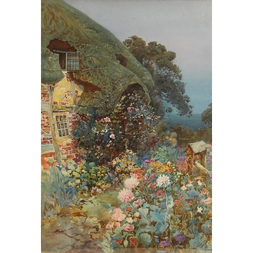 168 - * A C Wyatt (Scottish, 1863 -1933),  
A thatched cottage with colourful summer garden,  
Watercolour... 