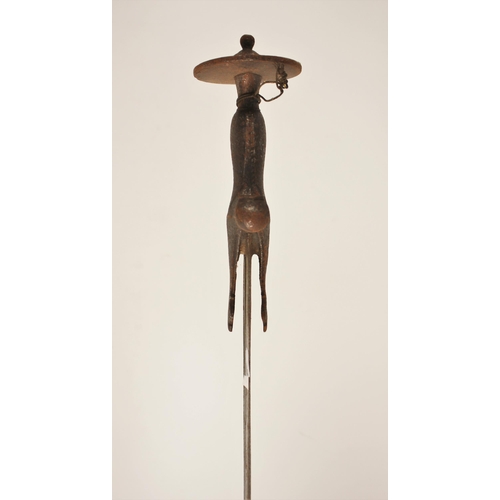 277 - An Indian Talwar, 18th/ 19th century, with curved fullered blade and iron hilt, the hilt with disc p... 