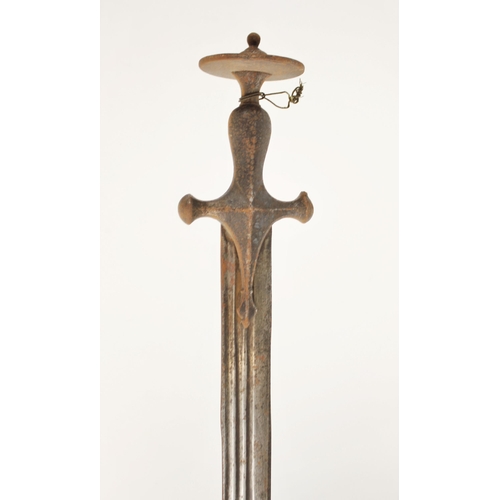 277 - An Indian Talwar, 18th/ 19th century, with curved fullered blade and iron hilt, the hilt with disc p... 