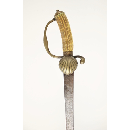 281 - A Hunting Hanger, circa 1730/40, probably English, with brass hilt cast in low relief, including flu... 