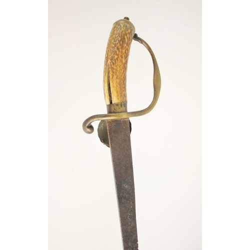 281 - A Hunting Hanger, circa 1730/40, probably English, with brass hilt cast in low relief, including flu... 