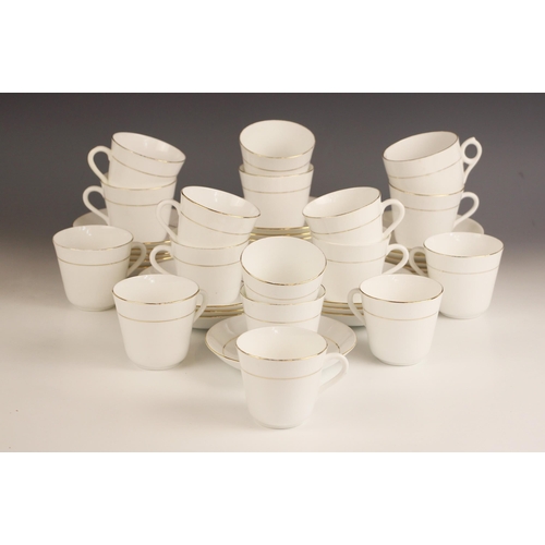 347 - A collection of Salon China teacups and saucers, each white glazed with gilt floral detail within gi... 