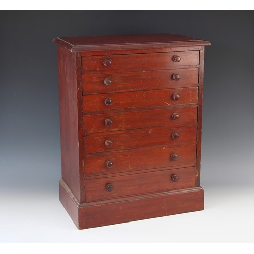 680 - A Victorian stained pine specimen cabinet, the rectangular moulded top over seven graduated and comp... 