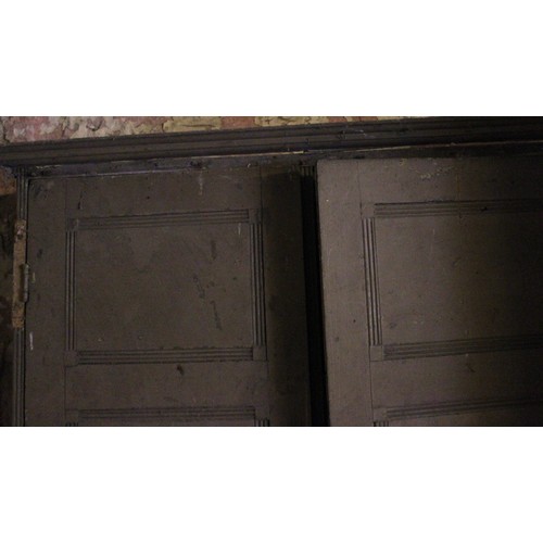 695 - * A George III painted pine housekeepers/bookcase cupboard, the pair of reeded panelled cupboard doo... 