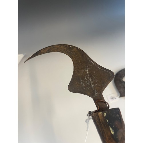 105 - A 19th century Congalese songye axe with copper covered handle, finely cast blade with two small mas... 