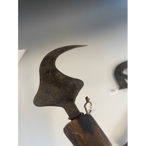 105 - A 19th century Congalese songye axe with copper covered handle, finely cast blade with two small mas... 