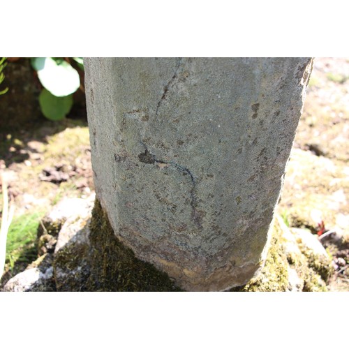 728 - * A sandstone plinth of hexagonal form, with sundial, raised on a capital, 105cm H