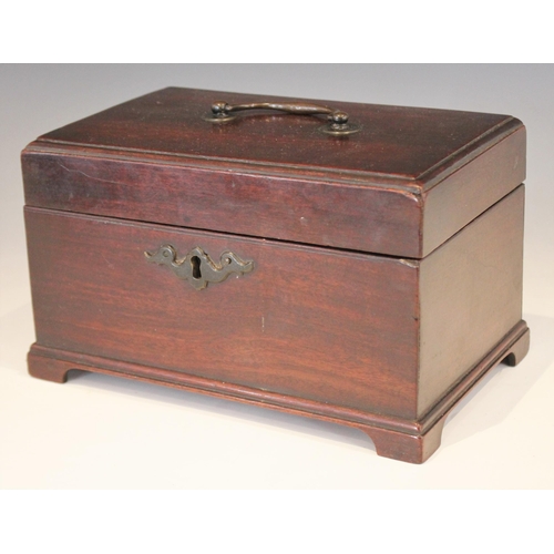 1072 - A George III mahogany tea caddy, of rectangular form with lip moulded hinged cover, opening to a vac... 