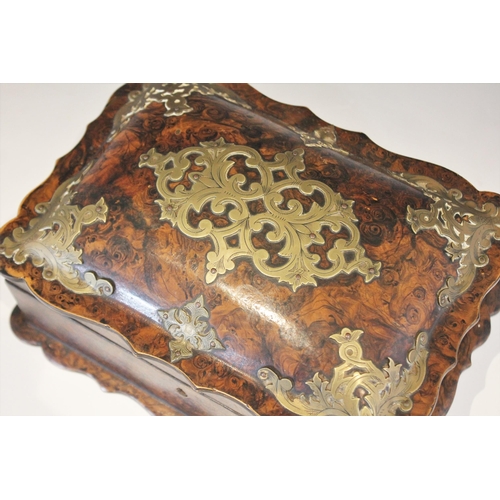 1073 - A 19th century faux tortoiseshell work box, the cushion top cover with shaped rim and brass pique, o... 