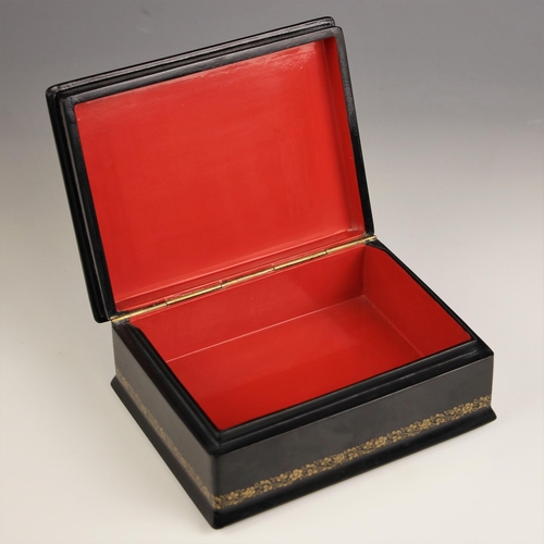 1074 - A Russian Fedoskino lacquered box and cover, 20th century, the hinged cover painted with a gentleman... 