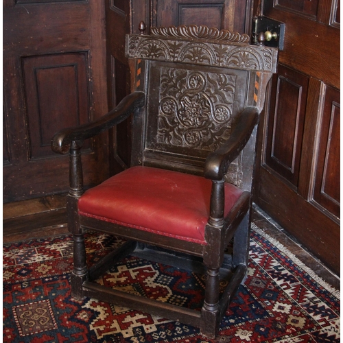 1090 - A 17th century oak Wainscot chair, the gadrooned top rail flanked by acorn finials above the back pa... 