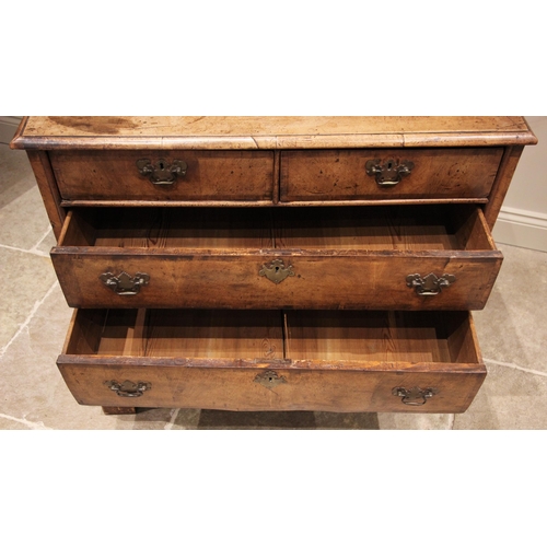 1098 - A William and Mary walnut chest of drawers, early 18th century, the rectangular moulded top over two... 