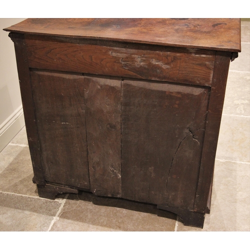 1101 - A Jacobean oak chest of drawers, the plank top above an arrangement of three elm lined long drawers,... 