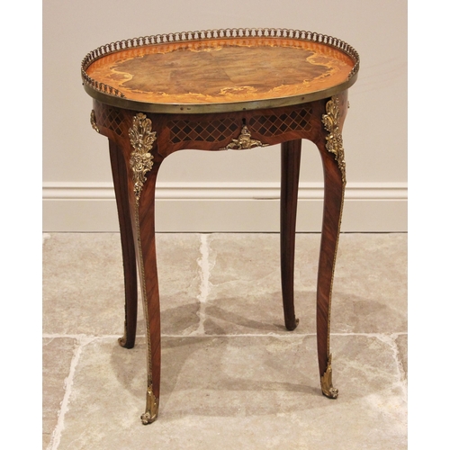 1165 - A French Louis XV style walnut and marquetry occasional table, mid 20th century, the book veneered o... 