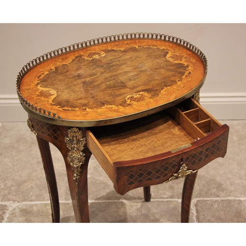 1165 - A French Louis XV style walnut and marquetry occasional table, mid 20th century, the book veneered o... 