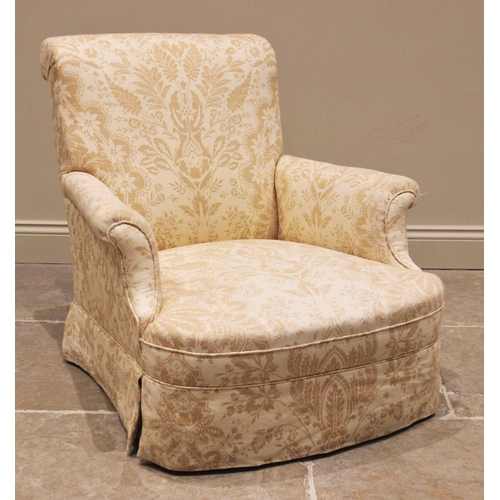 1175 - A late Victorian armchair, in the style of Howard & Sons, of typical deep seated form, with padded s... 