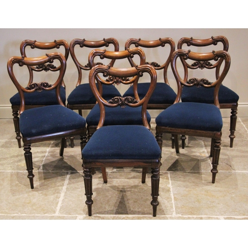 1180 - A set of eight early Victorian rosewood dining chairs, circa 1860, each with a compressed balloon ba... 