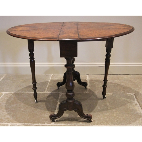 1181 - A Victorian figured walnut Sutherland table, the moulded oval drop leaf top upon baluster and bulbou... 