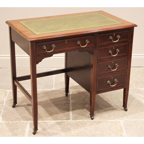 1198 - An Edwardian mahogany writing desk, the rectangular moulded top inset with a green leather and gilt ... 