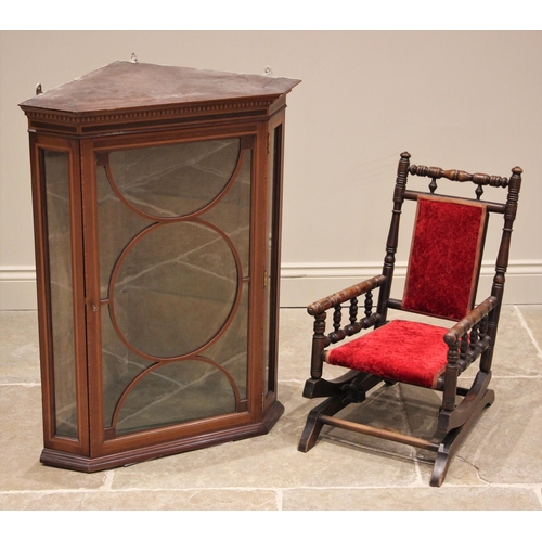 1201 - An Edwardian mahogany hanging glazed corner display cabinet, with a moulded simulated dentil cornice... 