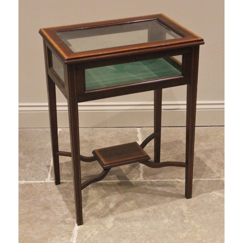 1204 - An Edwardian mahogany and satinwood banded bijouterie table, the hinged bevelled glass cover opening... 