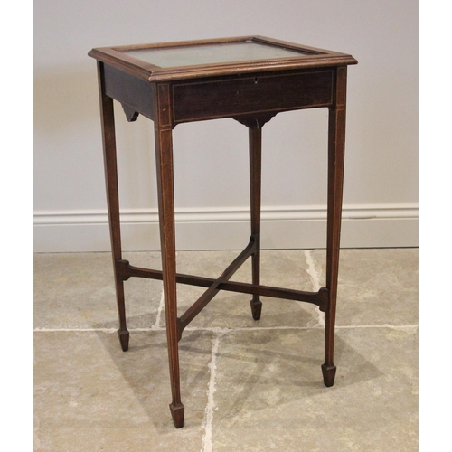 1208 - An Edwardian mahogany bijouterie table, the hinged square top inlaid with chequered stringing openin... 