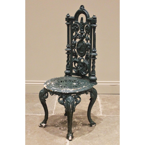 1239 - A Victorian Coalbrookdale style cast iron garden/patio chair, the openwork architectural high back c... 