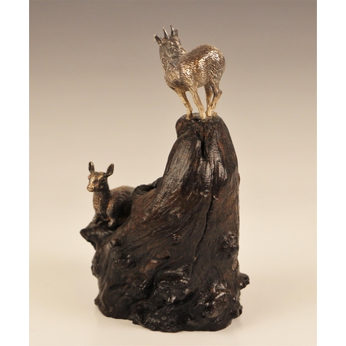 13 - A Patrick Mavros (Zimbabwean, 21st century) silver model of two Klipspringer upon a wooden outcrop, ... 