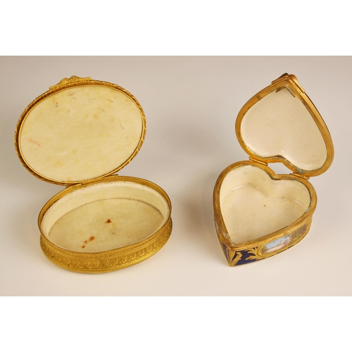 480 - A porcelain enamel Sevres style trinket box, 20th century, of heart shaped form, with a central scen... 