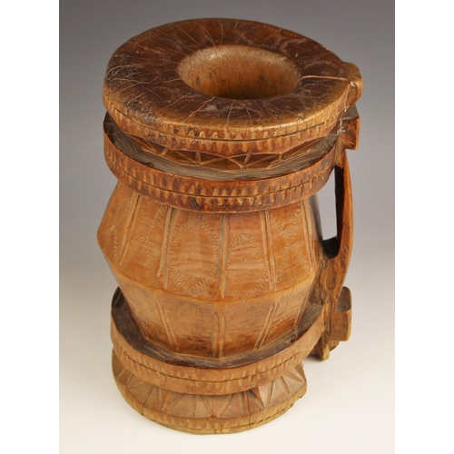 507 - A carved wooden tankard of large proportions, possibly Scandinavian, of dodecagonal form with upper ... 