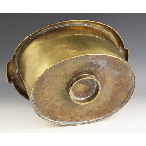 570 - A 19th century brass cellaret liner of oval form, the stepped rim incorporating two lug handles, lat... 