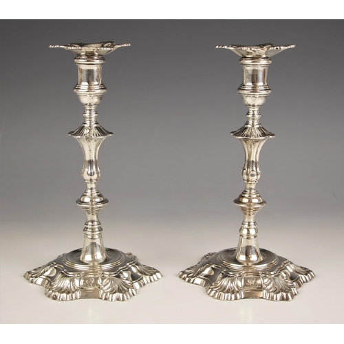 6 - A pair of George II silver candlesticks, James Morison, London 1748, each with turned columns and tr... 