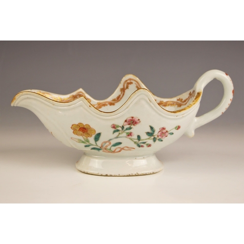 724 - A Chinese porcelain sauceboat, 18th century, decorated in the famille rose palette, with petal shape... 