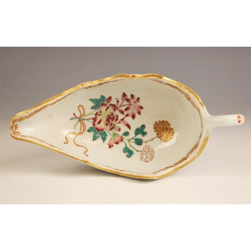 724 - A Chinese porcelain sauceboat, 18th century, decorated in the famille rose palette, with petal shape... 