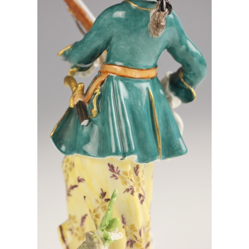 765 - A Meissen porcelain figure of a huntswoman, late 19th century, the figure modelled standing holding ... 