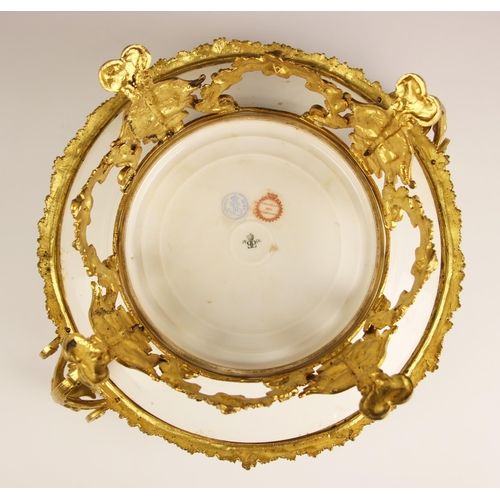 788 - A Sevres Chateau des Tuileries ormolu mounted tazza, 19th century, the well painted with a courting ... 