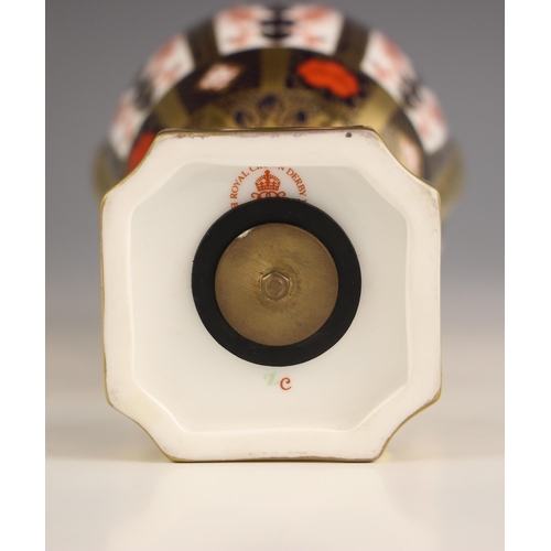 847 - A Royal Crown Derby Imari urn, pattern number 1128, of ovoid form with high scroll handles, on flute... 