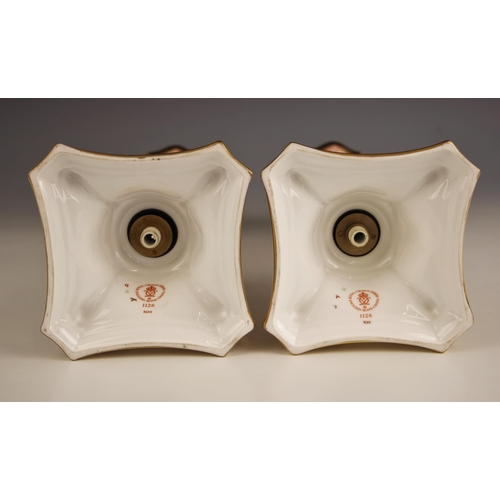 848 - A pair of Royal Crown Derby Imari candlesticks, pattern number 1128, each of fluted tapering form, t... 