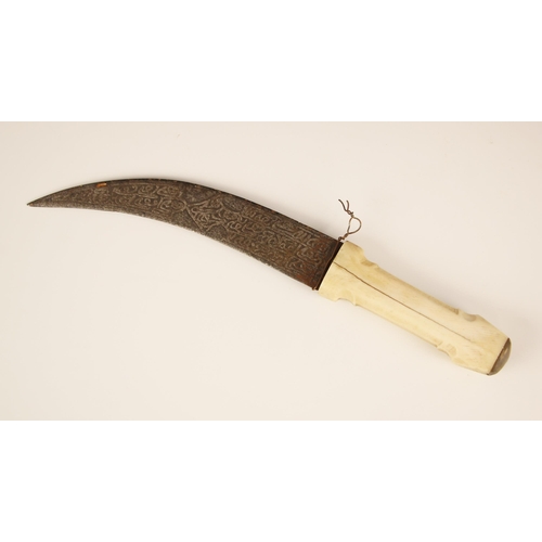 934 - A North African tribal dagger, second half 19th century, with carved bone hilt and curved flat blade... 