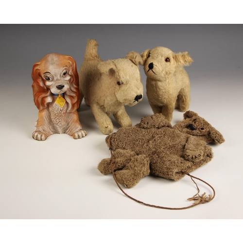 1014 - Two plush dog toys, mid 20th century, the largest 17cm high, a child's teddy bear hand warmer, 26cm ... 