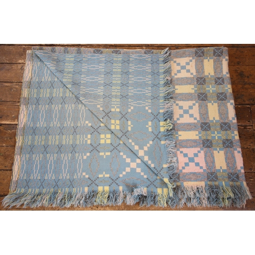 1034 - A Welsh wool blanket, of traditional reversible geometric design in blue, lime, pink, cream and grey... 