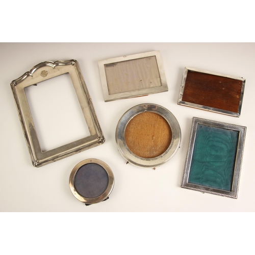 120 - A selection of six silver mounted photograph frames, including an Edwardian silver mounted circular ... 