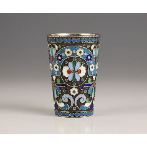 130 - A Russian silver 'vodka' cup, Moscow, possibly Pyotr Baskakov, of typical form with all over enamel ... 