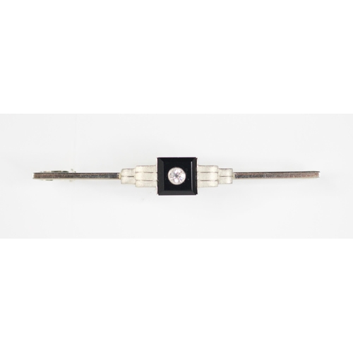 362 - An Art Deco diamond and enamel bar brooch, the central old cut diamond in white metal milgrain setti... 