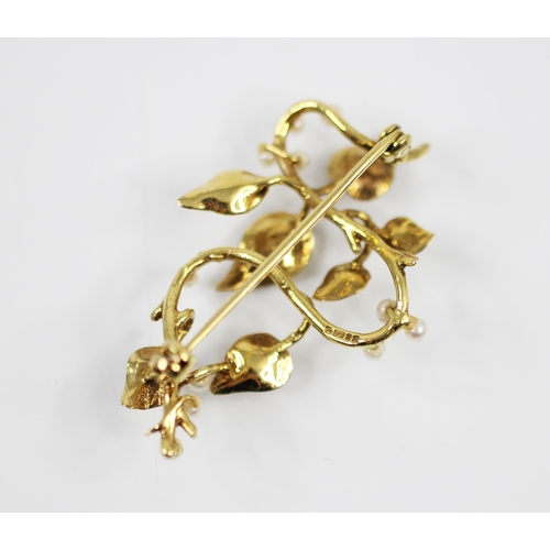 374 - A late 20th century 9ct yellow gold and seed pearl spray brooch, the plain polished stylised stem wi... 