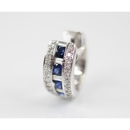 375 - A pair of untested sapphire and diamond half hoop/cuff style earrings, the central channel with four... 