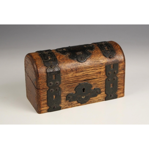 561 - A Grand Tour oak cased inkwell set, early 19th century, modelled as a domed trunk of small proportio... 