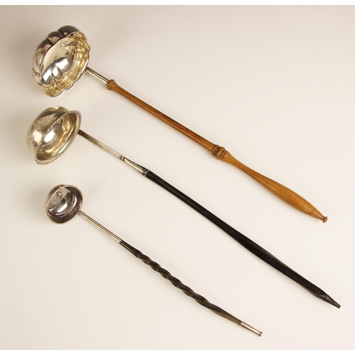 89 - Three toddy ladles, to include; a London 1981 example with turned wooden handle, 32.5cm long, a furt... 